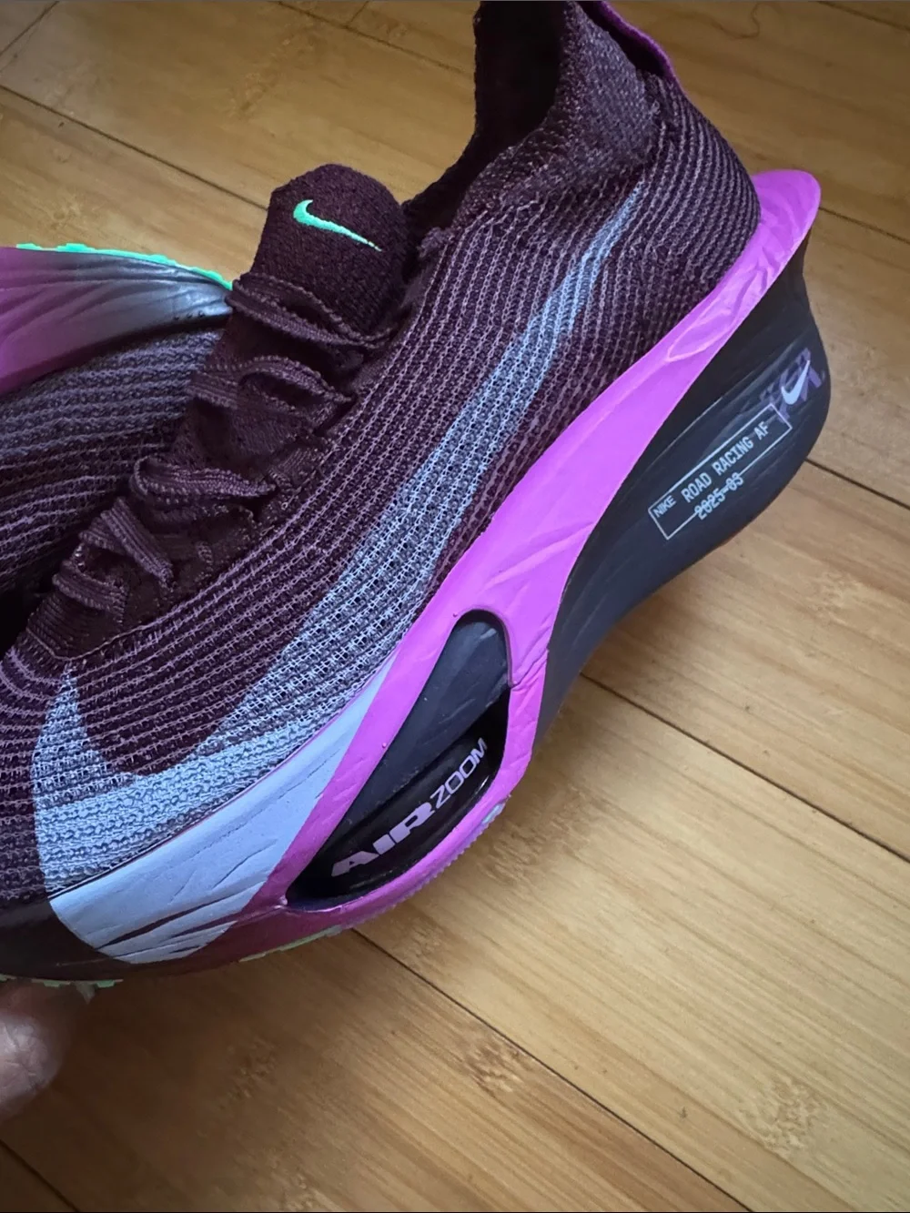 Nike Women’s Flyknit Trainers — Plum with Pink Accents